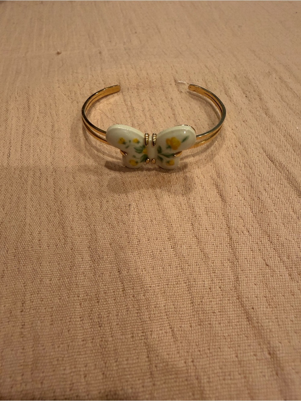 Avon Gold Cuff Bracelet with White Porcelain Butterfly and Yellow Floral Accent